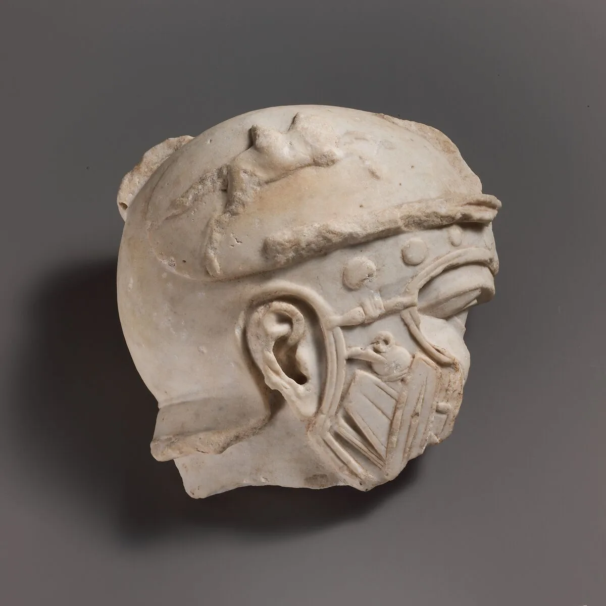 Fragmentary marble head of a helmeted soldier — Unknown