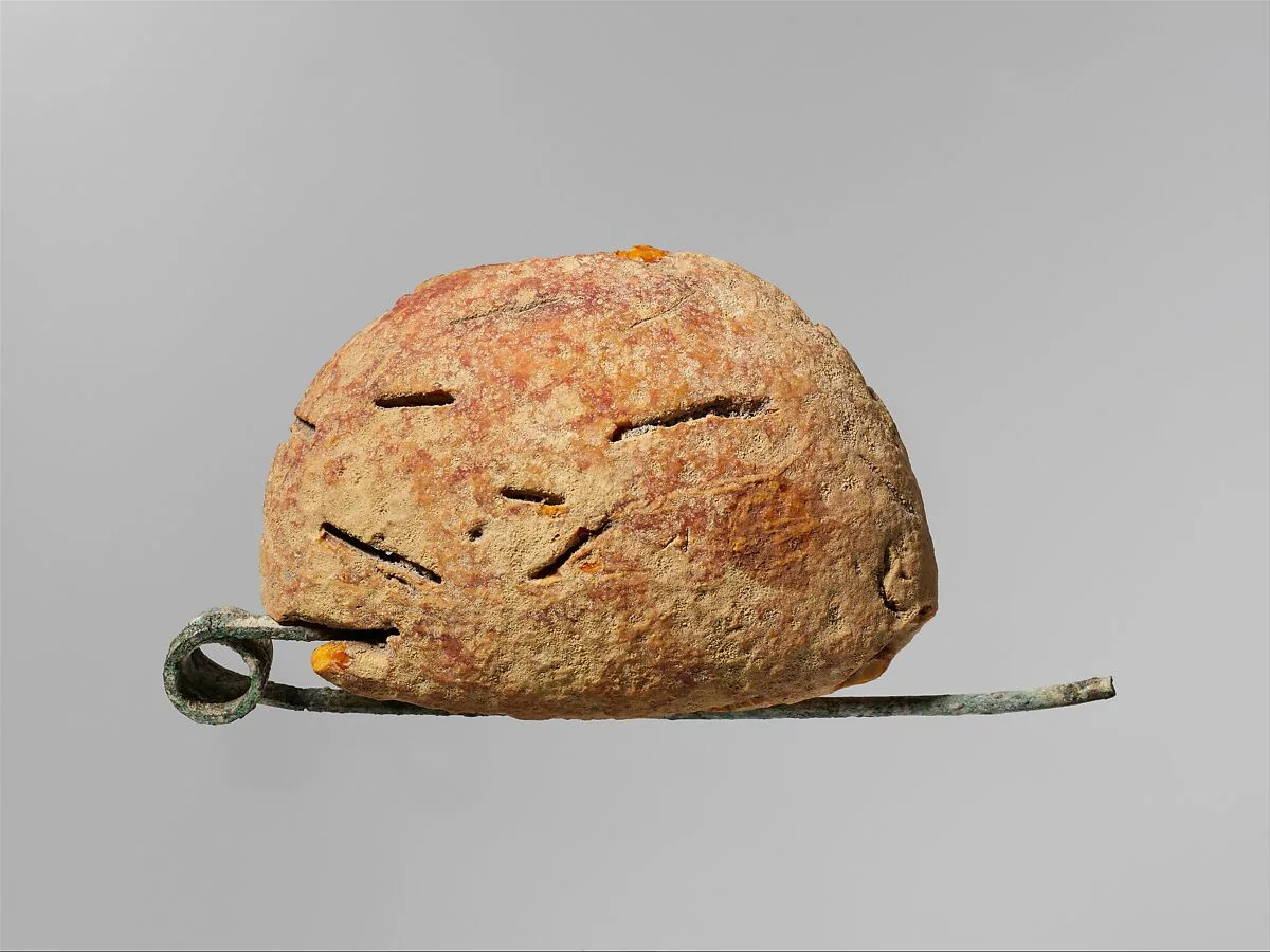 Bronze and amber fibula (safety pin) — Unknown