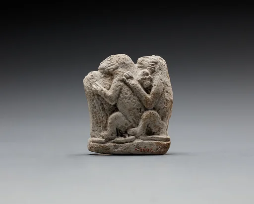 Monkey couple, the first playing a harp?