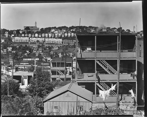 [View of Houses and Town with Apartment Building Rear in Foreground, Yonkers, New York]
