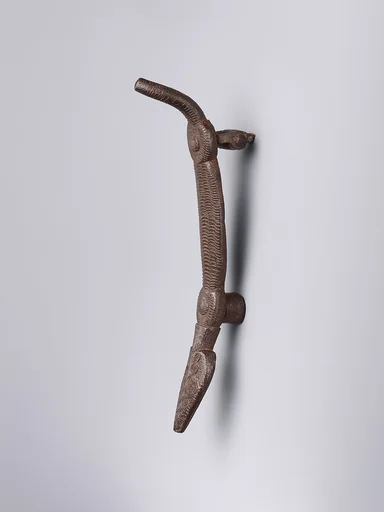 Door knocker in the shape of a crocodile-like creature