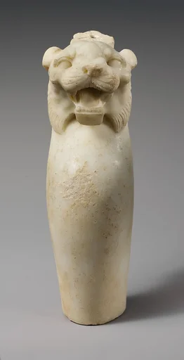 Marble leg of a table with a tiger's head