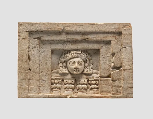 Furniture plaque carved in relief with a “woman at the window”