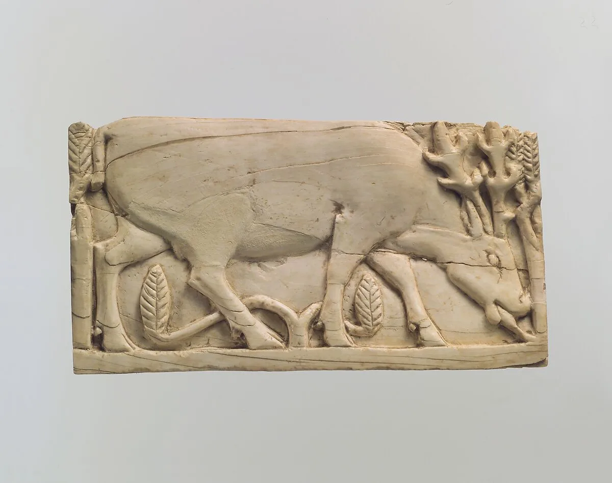 Furniture plaque carved in relief with a stag grazing among plants — Unknown