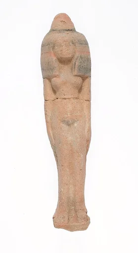 Standing female figurine wearing large headdress and wax cone