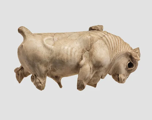 Furniture or cosmetic box plaque carved in the round with striding bull