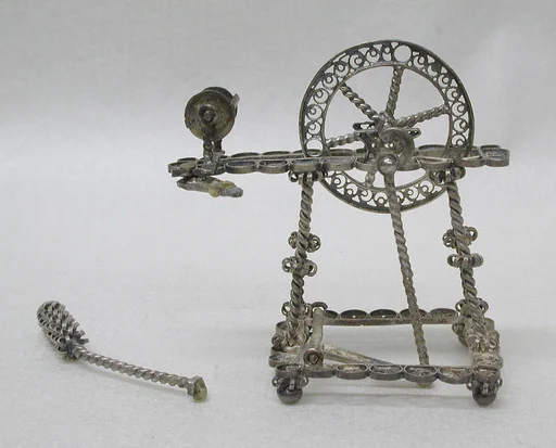 Miniature spinning wheel (part of a set)