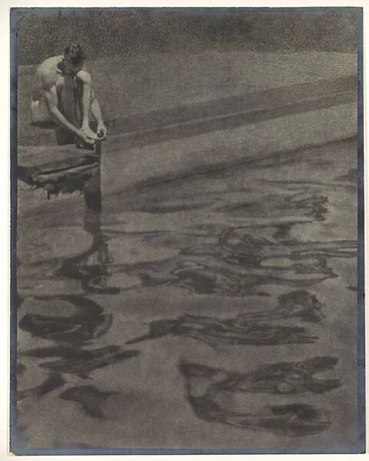 [Man Sitting at Edge of Swimming Pool with Surface Water Reflections]