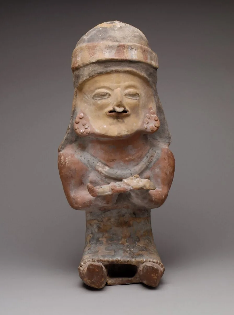 Figure Holding Child — Unknown