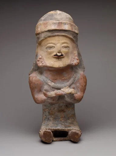 Figure Holding Child