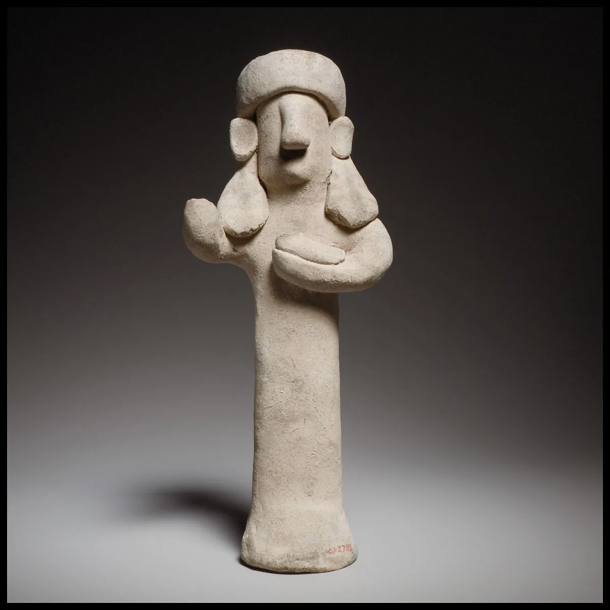 Standing male(?) figurine holding a bird — Unknown