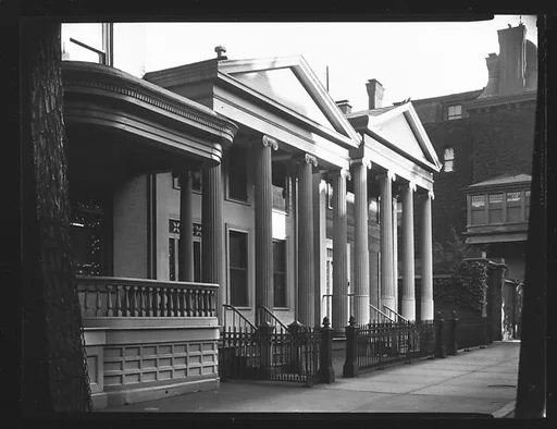 [Oblique View of Two Greek Revival Buildings Behind Cast-Iron Fence]