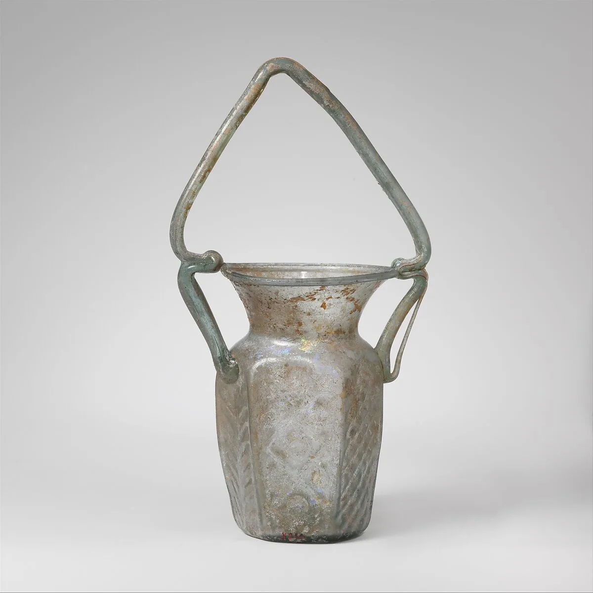 Glass hexagonal jar with basket handle — Unknown