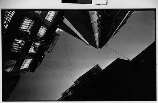 [Architectural Study: View Upwards of Fire Escapes and Balconies at Night, New York City]