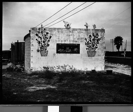 [Concrete Building with Shell and Flower Pot Decoration, Florida]
