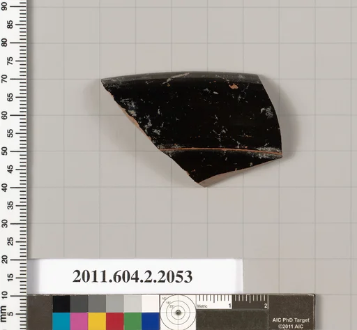 Terracotta fragment of a lid?