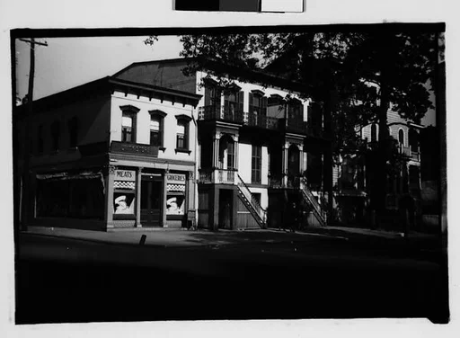 [Italianate Town Houses and Corner Grocery Store, From Automobile, Savannah, Georgia]