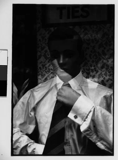 [Two 35mm Film Frames: Window Display of Mannequins in Front of Advertisement for "TIES", New York City]
