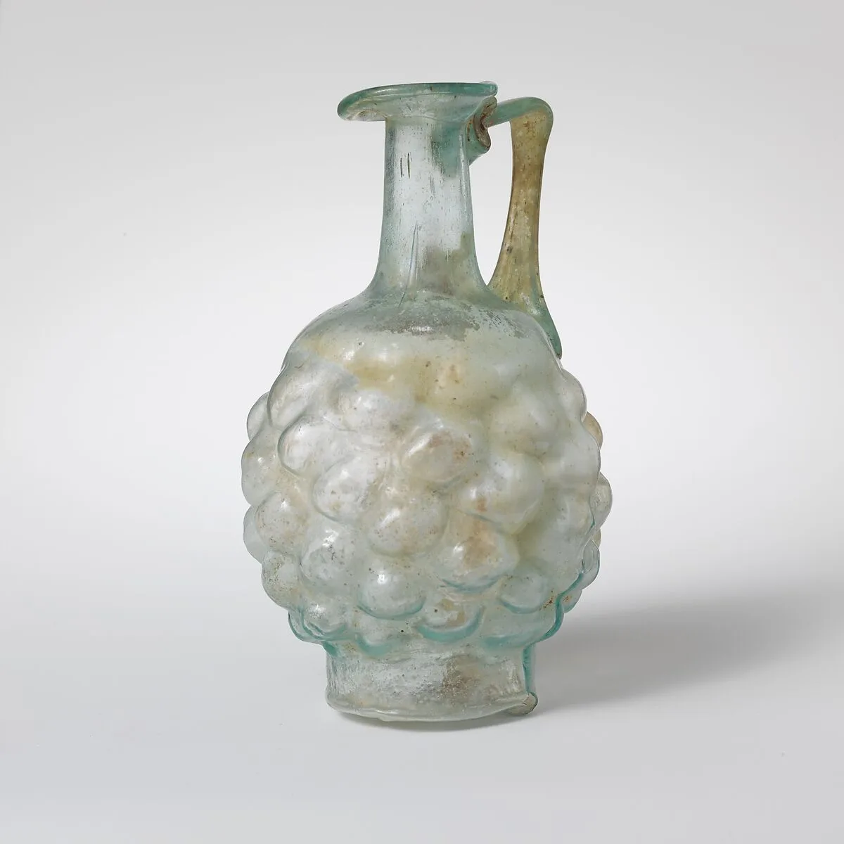 Glass jug in the form of a pine cone — Unknown