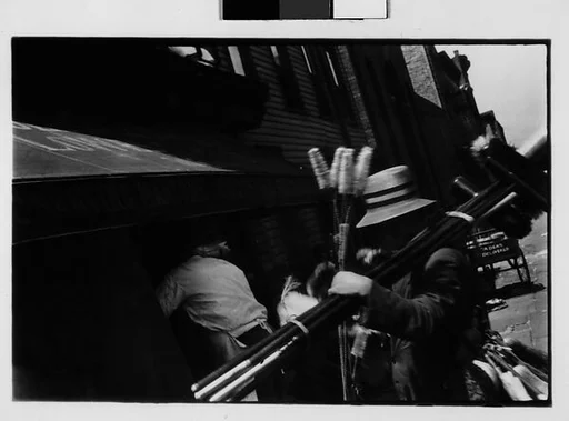 [Two 35mm Film Frames: Broom Vendor in Front of Grocery Store, New York City]
