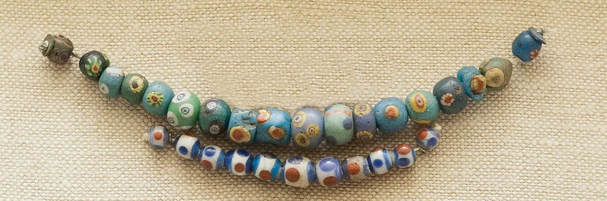 String of 11 Eyed Beads — Unknown