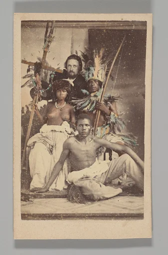 [Studio Portrait: Seated Group portrait with Man in European Dress and Three Indigenous people]
