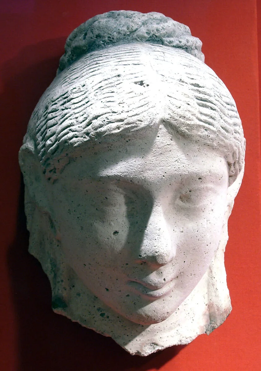 Mask of a woman with an austere hairstyle — Unknown