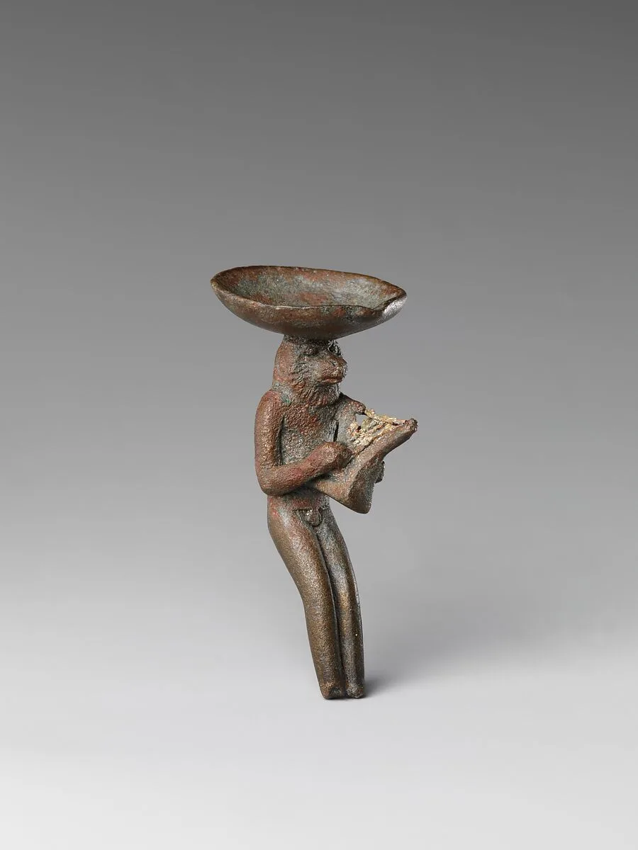 Monkey playing the lyre and carrying a dish on its head — Unknown