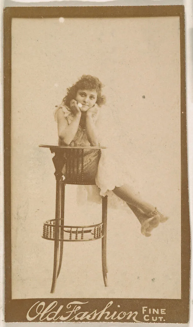 Actress posing on back of tall chair, from the Actresses series (N664) promoting Old Fashion Fine Cut Tobacco — Unknown
