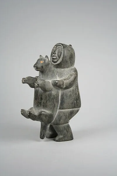 Stone Male in Parka Holding Animal — Tunu