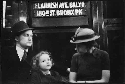 [Five 35mm Film Frames: Subway Passengers, New York City: Couple and Child Beneath "Flatbush Ave Brooklyn" Sign, Woman in Velvet Collar with Arm Around Child]