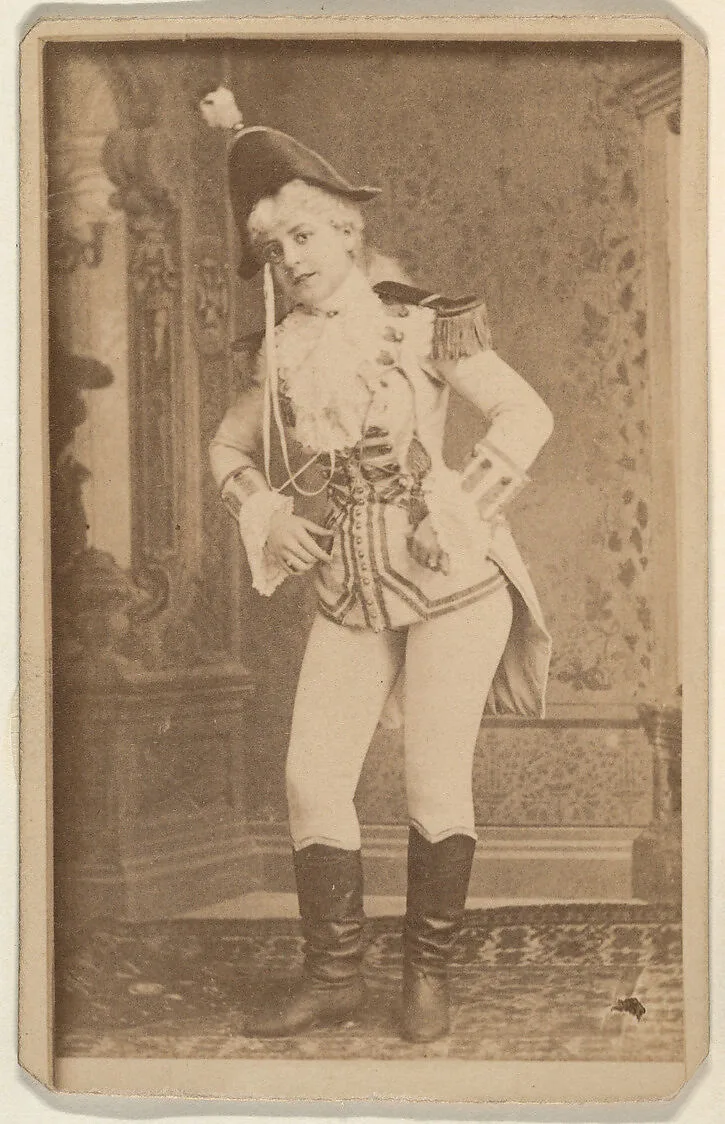 Actress wearing military costume standing with hands on hips, from the Actresses series (N668) — Unknown