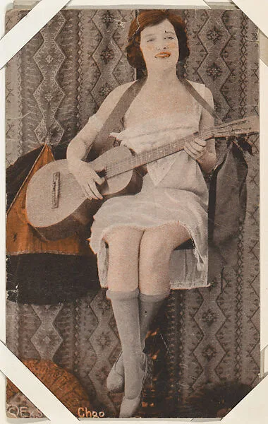 Actress in interior with guitar (W423) — Unknown