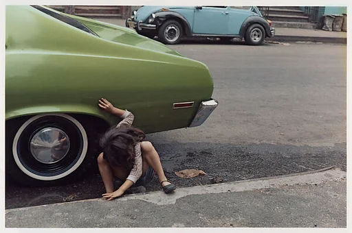 [Girl Playing Under Green Car, New York City]