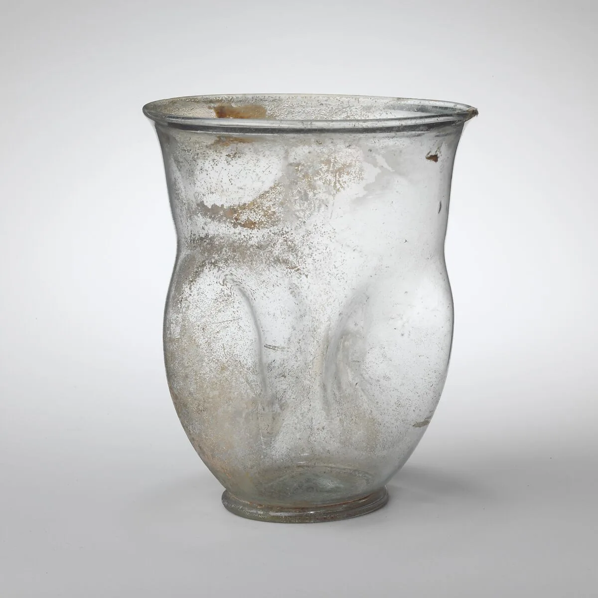 Glass beaker with indented sides — Unknown