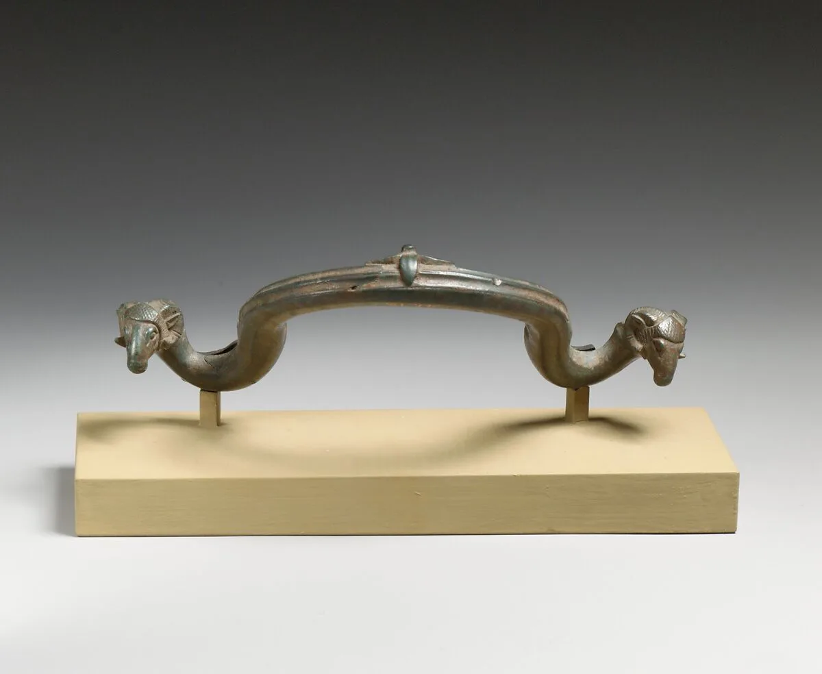 Bronze handle of a bowl or basin — Unknown