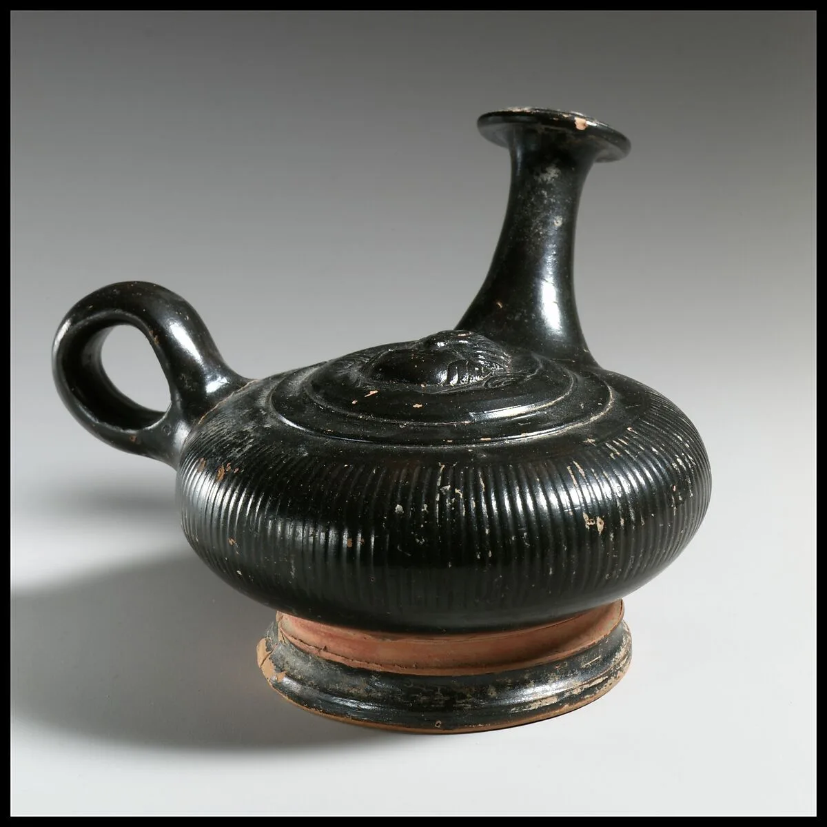 Terracotta guttus (flask with handle and vertical spout) — Unknown