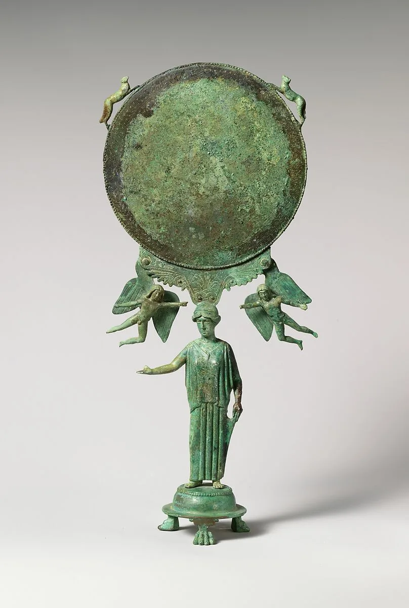 Bronze mirror with a support in the form of a draped woman — Unknown