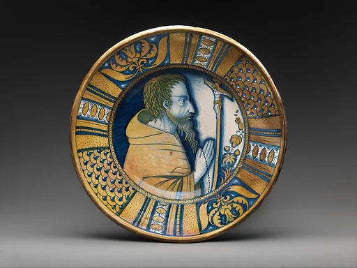 Dish with saint (Saint Francis?) or friar praying before crucifix