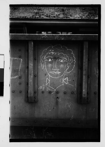 [Four 35mm Film Frames: Freight Car Graffiti]
