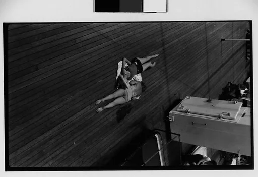 [South Seas: Two Women Sunbathing on the Deck of the Cressida, From Above]