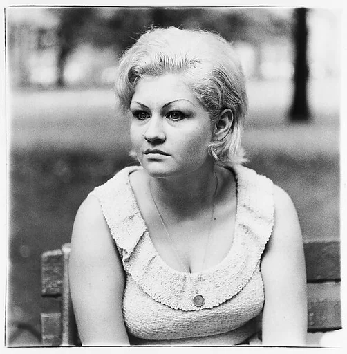 Woman with a locket in Washington Square Park, N.Y.C.