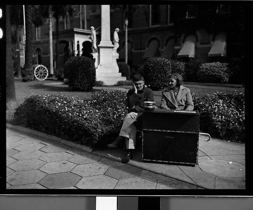 [Blind Couple Sitting in City Hall Square, Tampa, Florida]
