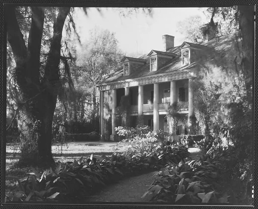 [Brick Greek Revival House with Ivy on Columns, Residence of Weeks Hall, New Iberia, Louisiana]
