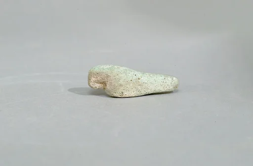Figurine of a crouching falcon
