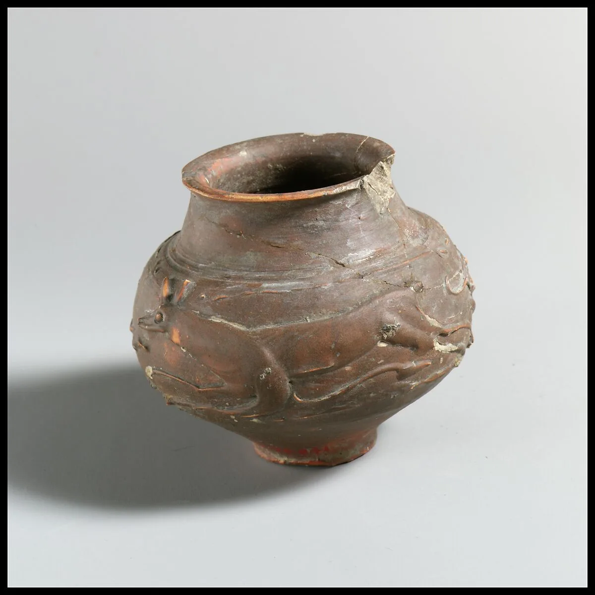 Terracotta beaker with barbotine decoration — Unknown
