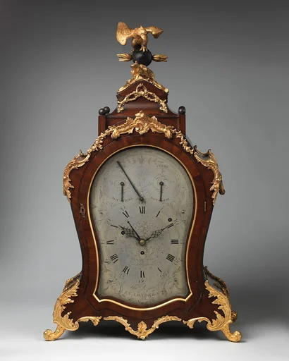 Musical bracket clock with calendar