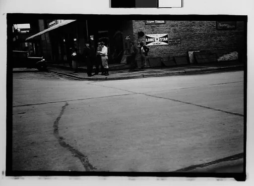 [Street Scene in Front of Builders Hardware Store, From Car, Mobile Vicinity, Alabama]