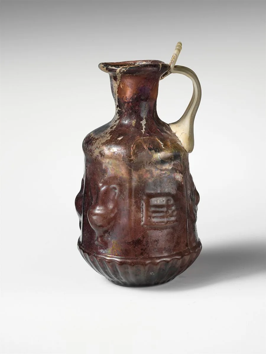 Glass hexagonal jug with Dionysiac symbols — Unknown