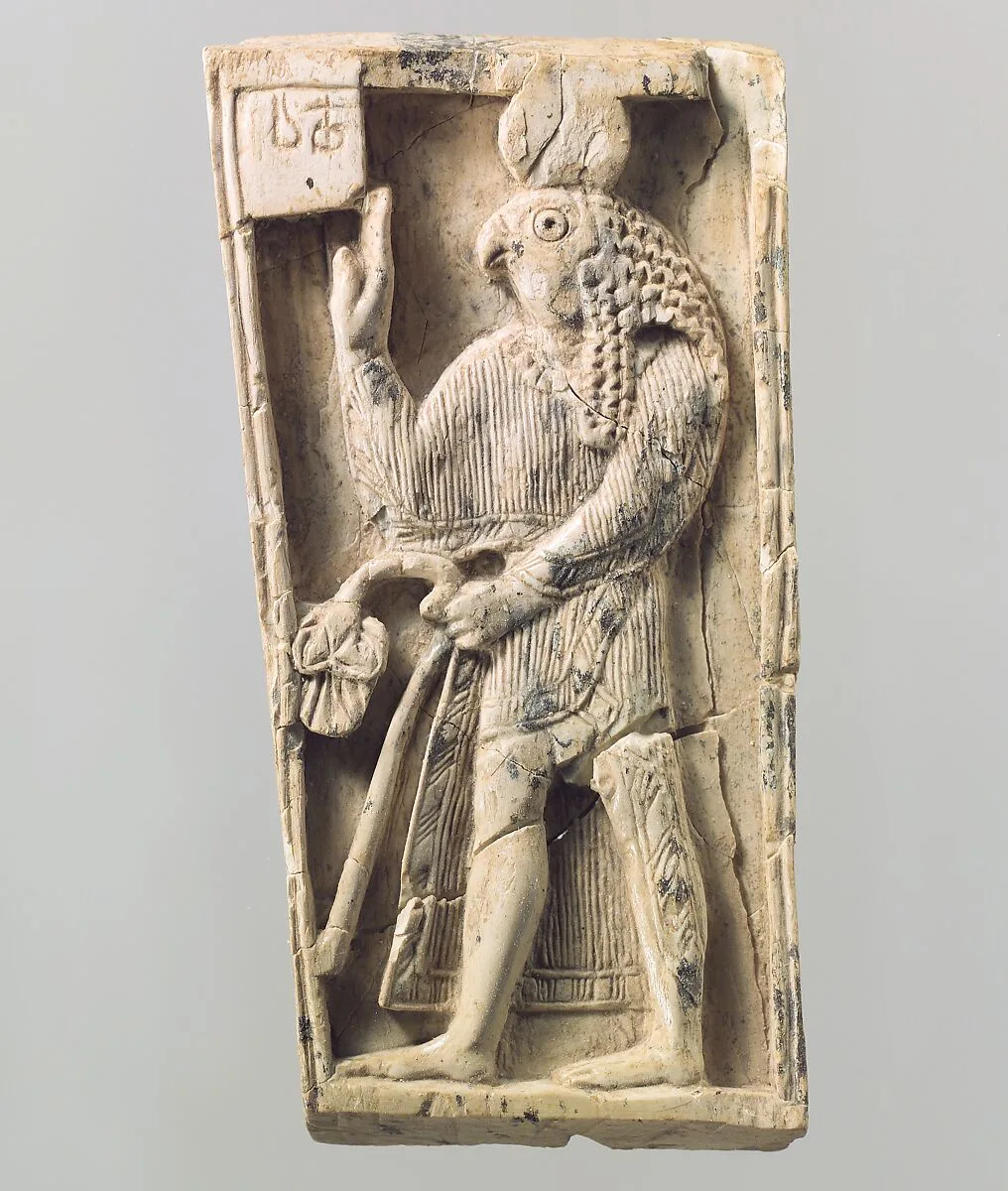 Furniture plaque carved in relief with a falcon-headed figure — Unknown